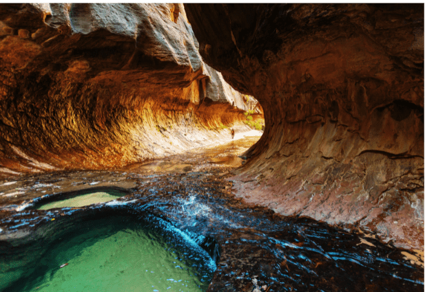 Weeping Rock in Zion National Park offers a unique and picturesque hiking destination, featuring a rock formation that appears to weep water droplets from the sandstone cliffs.