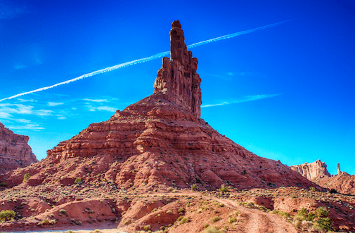 Desert towers rising majestically against a clear blue sky near Zion National Park.