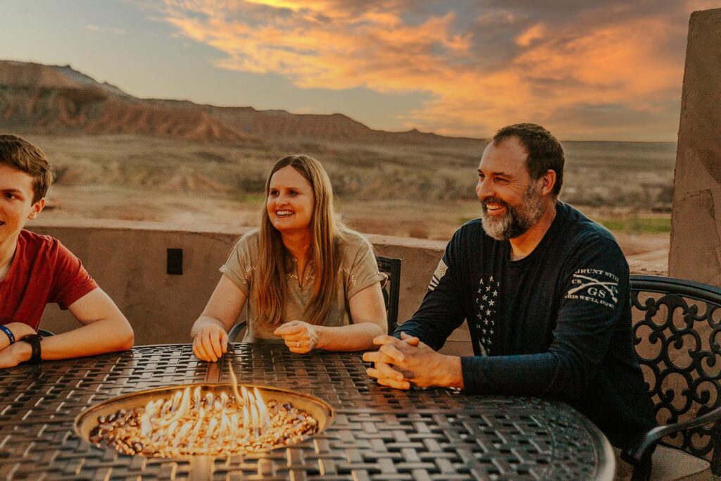 Family Enjoying Roof Top Deck At Zion White Bison Resort